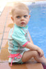 T-shirt Maillot de bain bleu et rose anti uv "jardin secret" pour bébé et enfant fille avec protection solaire UPF50+ et motifs cerises